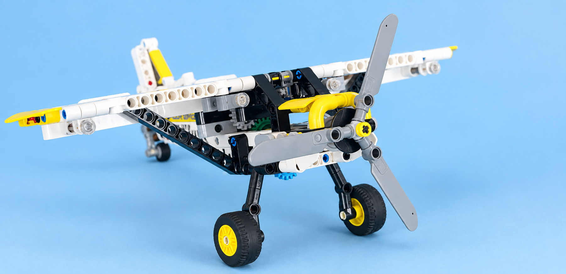 Professional studio photograph of Skye's white, yellow, and black LEGO airplane