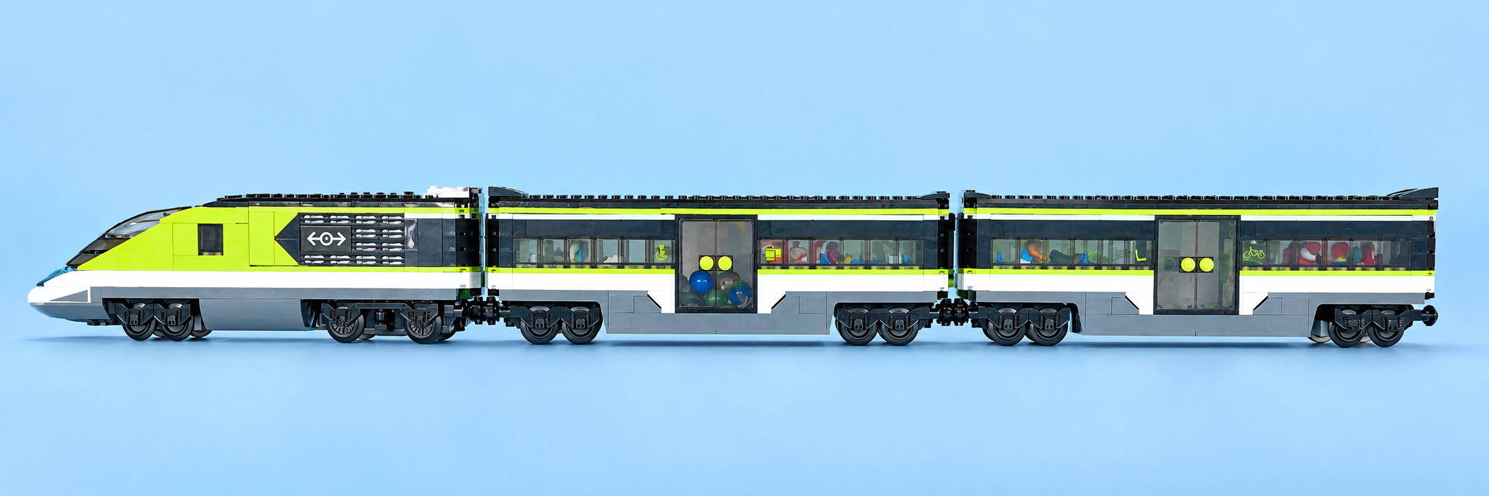 Professional studio photograph of Skye's long lime-green LEGO passenger train