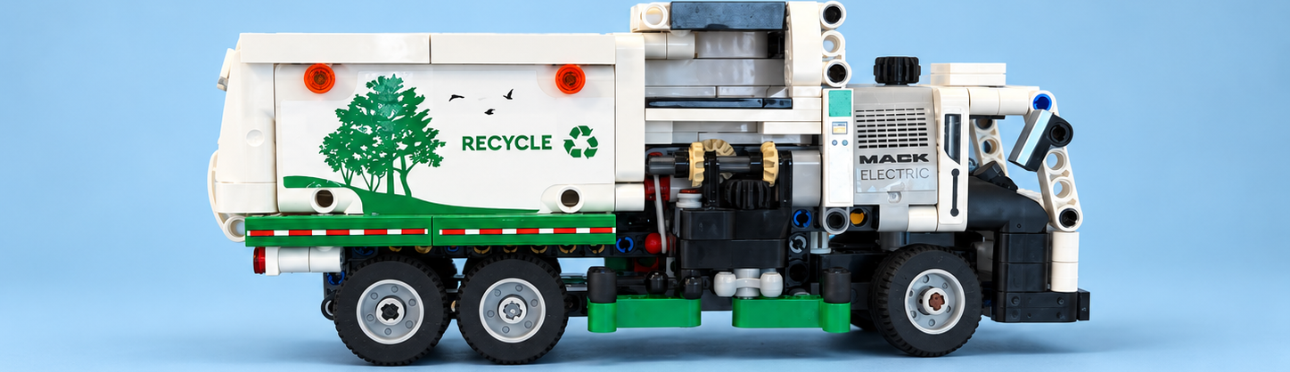 Professional studio photograph of Skye's white and green LEGO Mack electric recycling truck